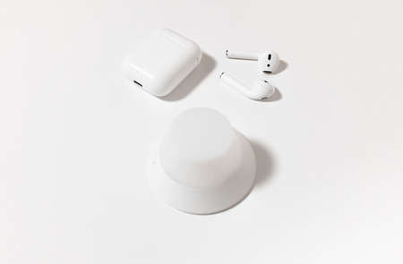 Headphones are on a white tableの写真素材
