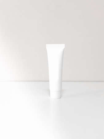 Beautiful tubes on a beautiful white table. No labels. For cosmetics.の写真素材