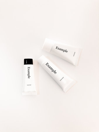 Beautiful tubes on a beautiful white table. No labels. For cosmetics.の写真素材