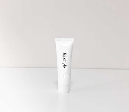 Beautiful tubes on a beautiful white table. No labels. For cosmetics.の写真素材