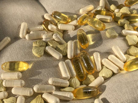Many vitamins lie on a soft pillow.の写真素材