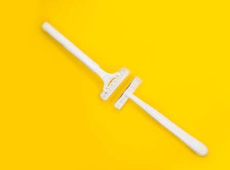 Shaving machine, minimalistic yellow background.の写真素材