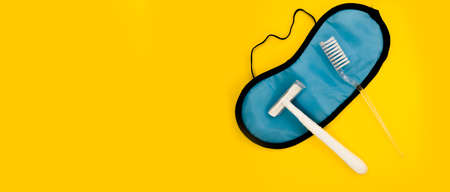 Mask for sleep. Tooth brush. Machine for shaving. Minimalistic yellow background.の写真素材