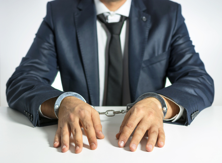 Businessman with handcuffs