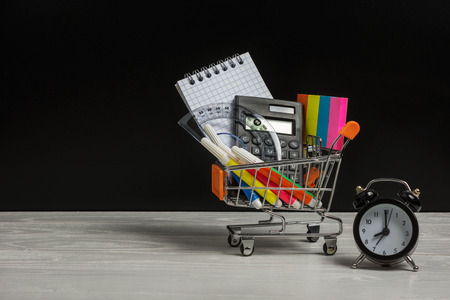 Back to school concept with many school supplies in a shopping cartの写真素材