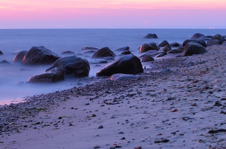 Stones in the sea at the sunset, Gdynia, Poland