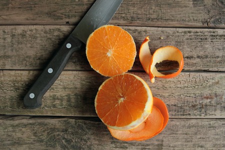 Sliced orange on wooden table の写真素材