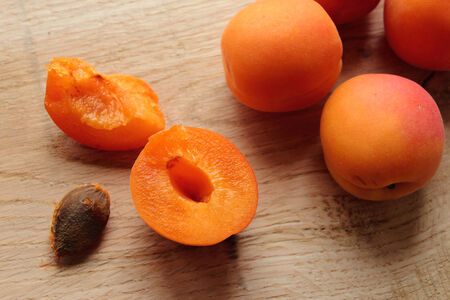 Apricot fruits sliced on a wooden desk