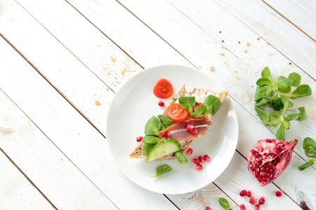 Crunchy bread with lettuce and smoked baconの写真素材