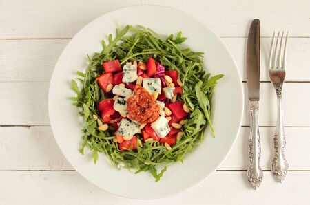 Fresh salad with rucola, paprika, mildew cheese and pestoの写真素材