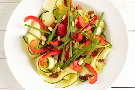 Salad with zucchini, paprika, fresh chive and chickenの写真素材