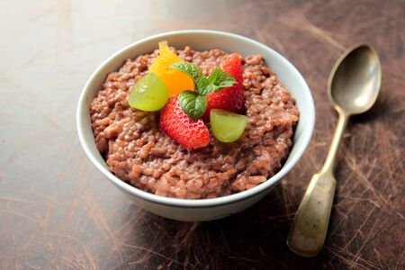 Chocolate rice pudding with fresh fruitsの写真素材