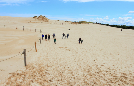 June 24, 2018: Tourist on sand dunes in Leba, Slowinski National Park, Polandのeditorial素材