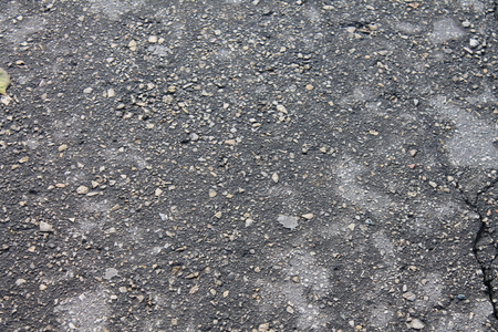 Old asphalt lying on the footpathsの写真素材