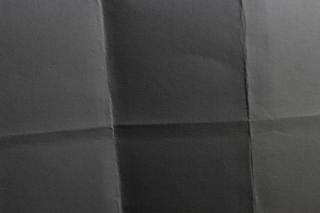 folded several times a sheet of paperの写真素材