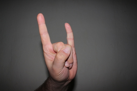Man's hand showing different signsの写真素材