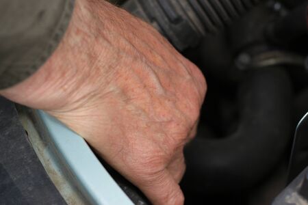 A man's deals with the prevention of a motor vehicleの写真素材