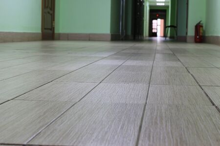 The floor tiles in the hallway of the buildingの写真素材