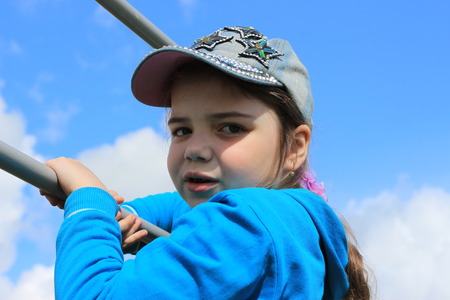 The girl does exercises at sports equipmentの写真素材