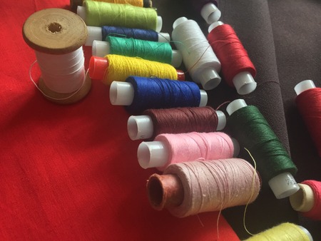 Fabric samples and threadの写真素材