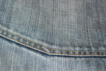 different parts of old jeans background or textureの写真素材