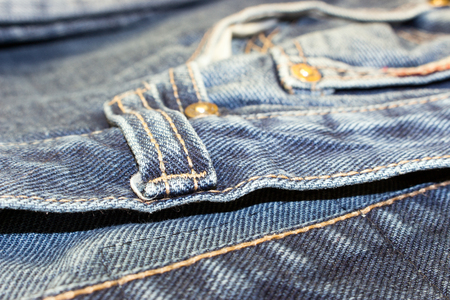different parts of old jeans background or textureの写真素材