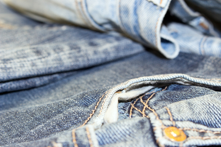 different parts of old jeans background or textureの写真素材