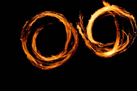Fire Circles in the darkの写真素材