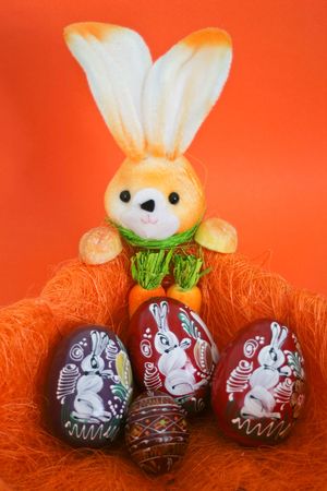 Easter Bunny with easter eggs in an orange compositionの写真素材