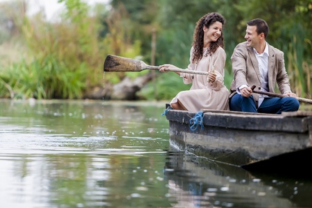 Young couple in the boatの写真素材