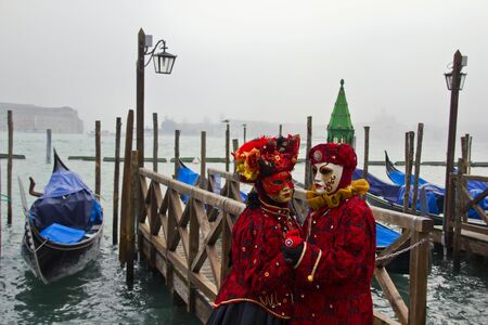 Venice, Italy, February 10, 2013: Unidentified person with traditional Venetian carnival mask in Venice, Italy at February 10, 2013. At 2013 it is held from January 26th to February 12th. のeditorial素材