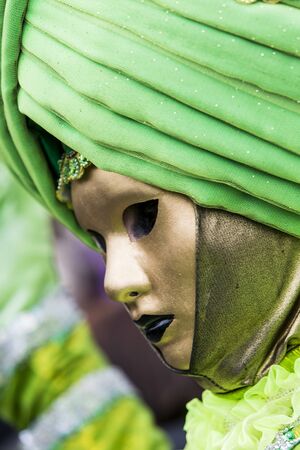 Venice, Italy, February 9, 2013: Unidentified person with traditional Venetian carnival mask in Venice, Italy at February 10, 2013. At 2013 it is held from January 26th to February 12th.のeditorial素材