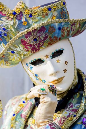 Venice, Italy, February 9, 2013: Unidentified person with traditional Venetian carnival mask in Venice, Italy at February 10, 2013. At 2013 it is held from January 26th to February 12th.のeditorial素材