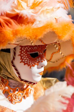 Venice, Italy, February 10, 2013: Unidentified person with traditional Venetian carnival mask in Venice, Italy at February 10, 2013. At 2013 it is held from January 26th to February 12th.のeditorial素材