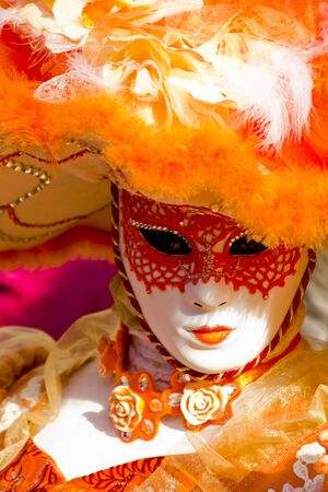 Venice, Italy, February 9, 2013: Unidentified person with traditional Venetian carnival mask in Venice, Italy at February 10, 2013. At 2013 it is held from January 26th to February 12th.のeditorial素材
