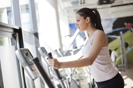 Young woman training in the gymの写真素材