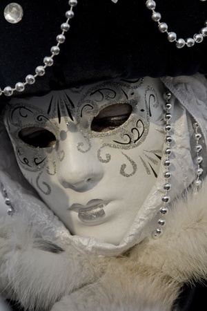 Venice, Italy, February 9, 2013: Unidentified person with traditional Venetian carnival mask in Venice, Italy at February 10, 2013. At 2013 it is held from January 26th to February 12th.のeditorial素材