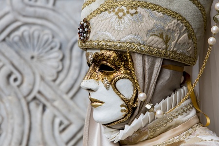 Venice, Italy, February 9, 2013: Unidentified person with traditional Venetian carnival mask in Venice, Italy at February 10, 2013. At 2013 it is held from January 26th to February 12th.のeditorial素材