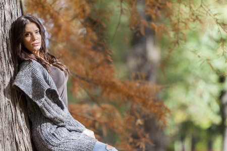 Young woman in the autumn forestの写真素材