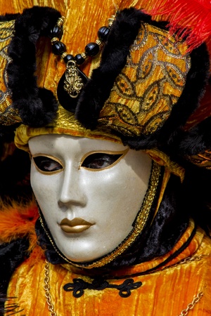 Venice, Italy, February 9, 2013: Unidentified person with traditional Venetian carnival mask in Venice, Italy at February 10, 2013. At 2013 it is held from January 26th to February 12th.のeditorial素材