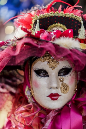Venice, Italy, February 9, 2013: Unidentified person with traditional Venetian carnival mask in Venice, Italy at February 10, 2013. At 2013 it is held from January 26th to February 12th.のeditorial素材