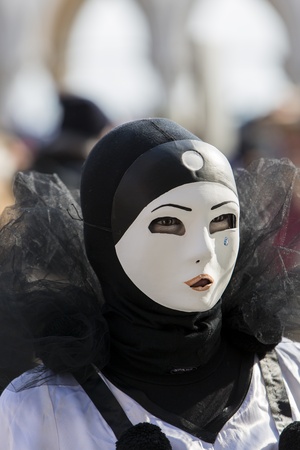 Venice, Italy, February 9, 2013: Unidentified person with traditional Venetian carnival mask in Venice, Italy at February 10, 2013. At 2013 it is held from January 26th to February 12th.のeditorial素材