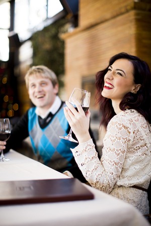 Romantic young couple in the restaurantの写真素材