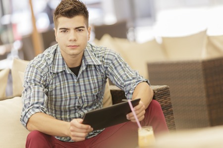 Young man with tabletの写真素材
