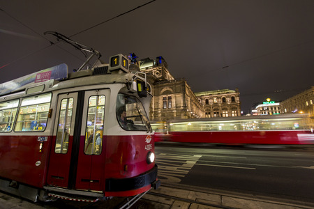 VIENNA AUSTRIA - FEBRUARY 5 2014: Trams at the street of Vienna at night. Vienna tramway network is one of world's largest tram networks, at about 180 km in total length and 1031 stations.のeditorial素材