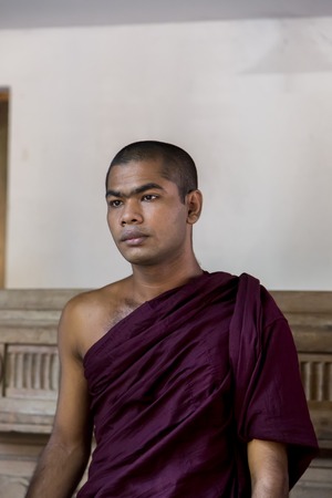 COLOMBO, SRI LANKA - JANUARY 18, 2014: Unidentified man at Gangaramaya Temple in Colombo, Sri Lanka. Gangaramaya Temple is one of the most important temples in Colombo, Sri Lankaのeditorial素材