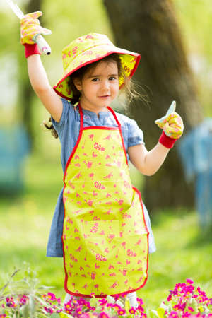 Little girl in the gardenの写真素材