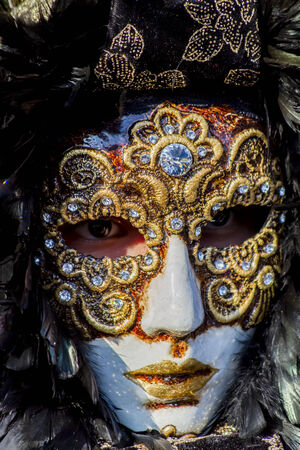 VENICE, ITALY - FEBRUARY 10, 2013: Unidentified person with traditional Venetian carnival mask in Venice, Italy. At 2013 it is held from January 26th to February 12th.のeditorial素材