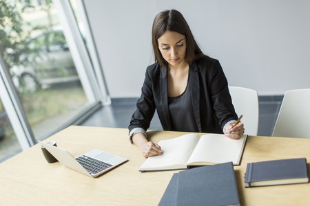 Young woman in the officeの写真素材