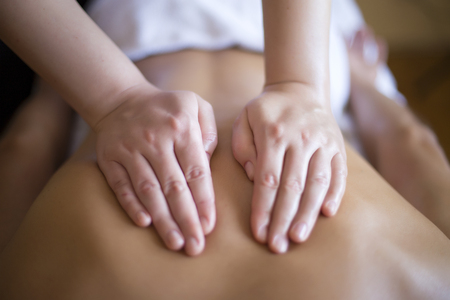 Young man having a massageの写真素材